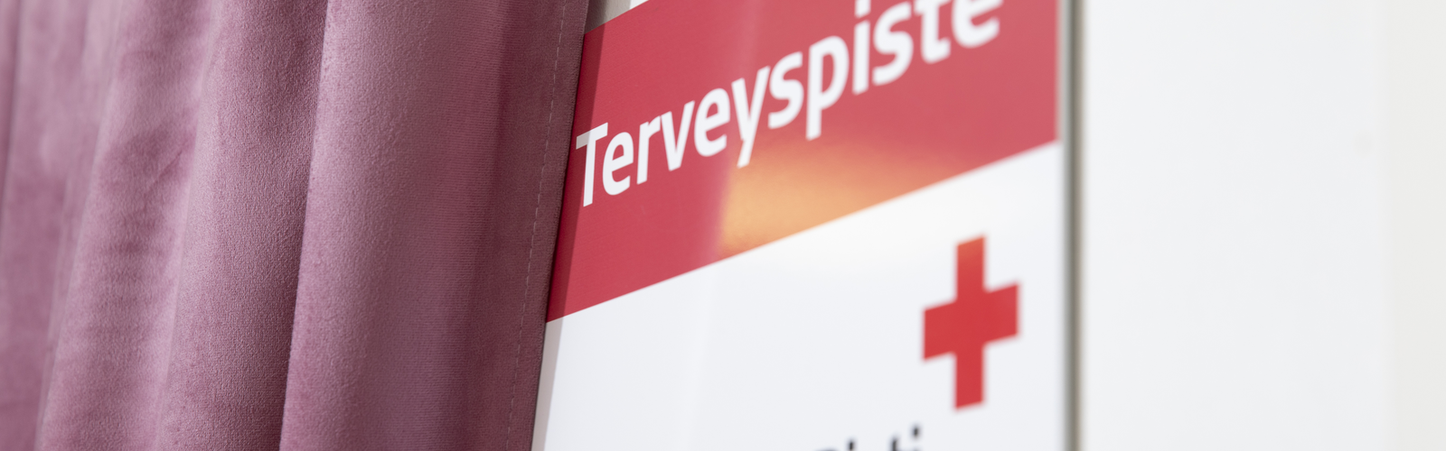Terveyspisteen seinäkyltti
